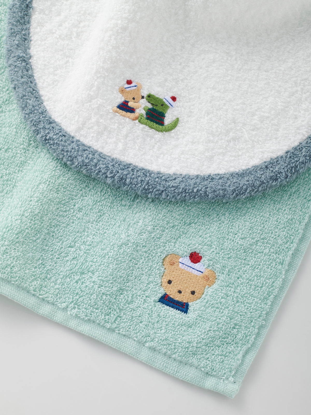 Set of bib, mascot and towel handkerchief
