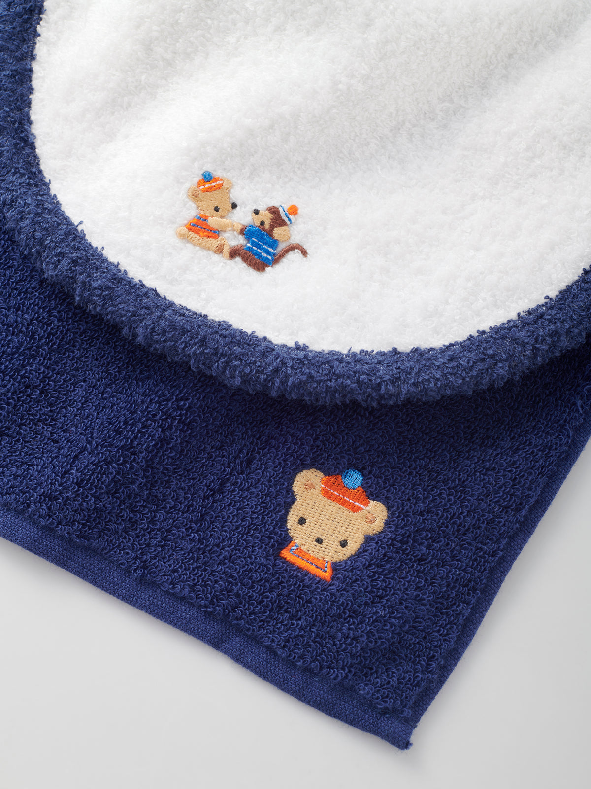 Set of bib, mascot and towel handkerchief