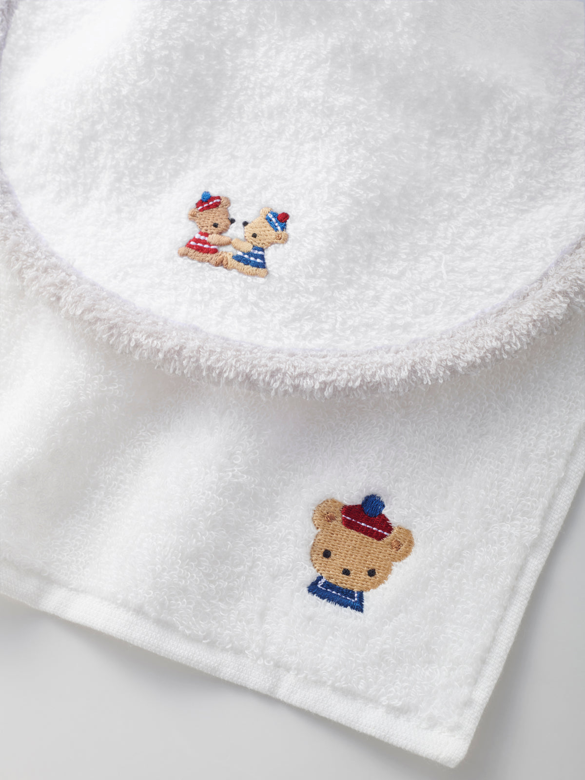 Set of bib, mascot and towel handkerchief