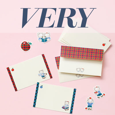 Colorful stationery with envelopes, stickers, and the word 