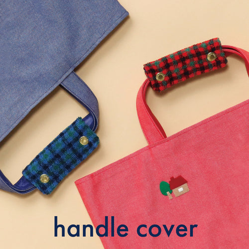 Two tote bags with patterned handle covers.