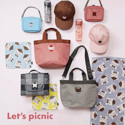 Various picnic bags and accessories arranged with the text 